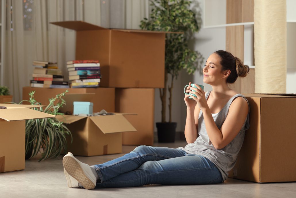 Woman settling into new appartment covered by renters insurance