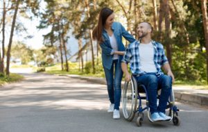Disabled man walking with wife protected by disability insurance coverage